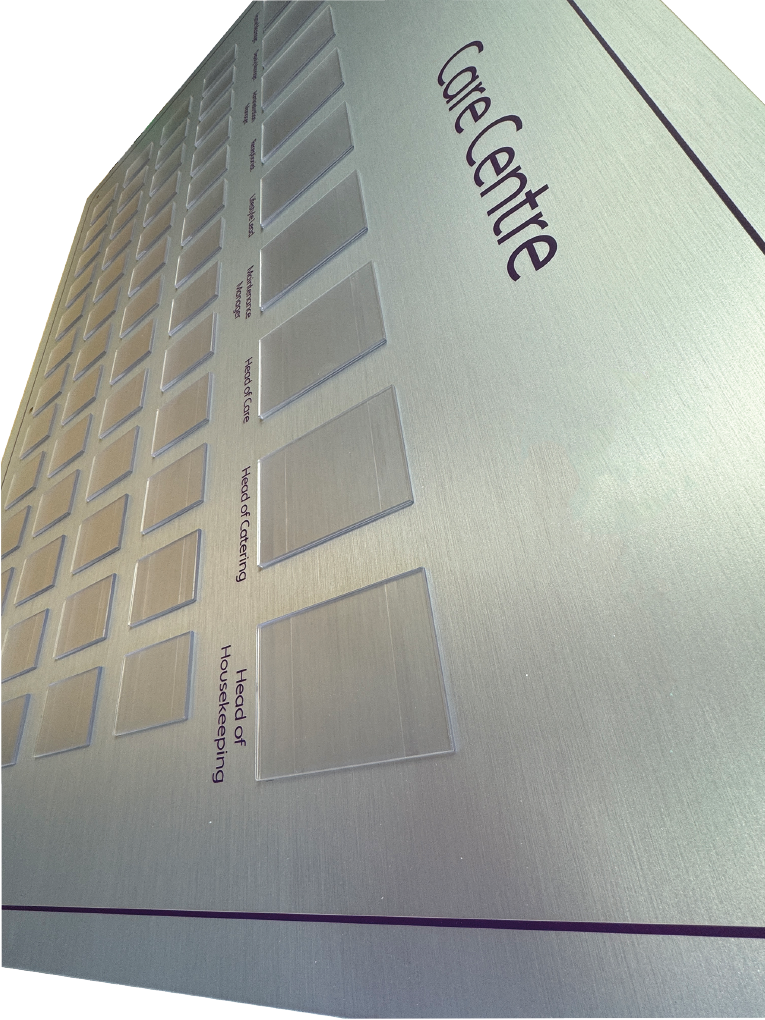 Brushed silver staff photo display board example showing pockets arrangement