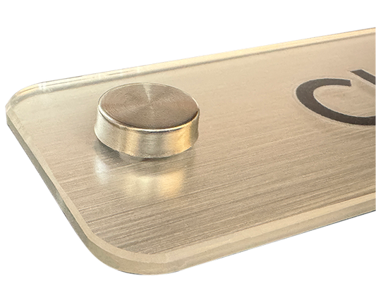 Close up detailed picture showing a brushed silver Operational sign fitting and chamfered edge