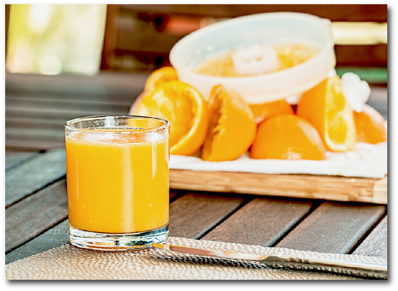 Dementia-friendly reminiscence image of a glass off freshly squeezed orange juice in a glass.