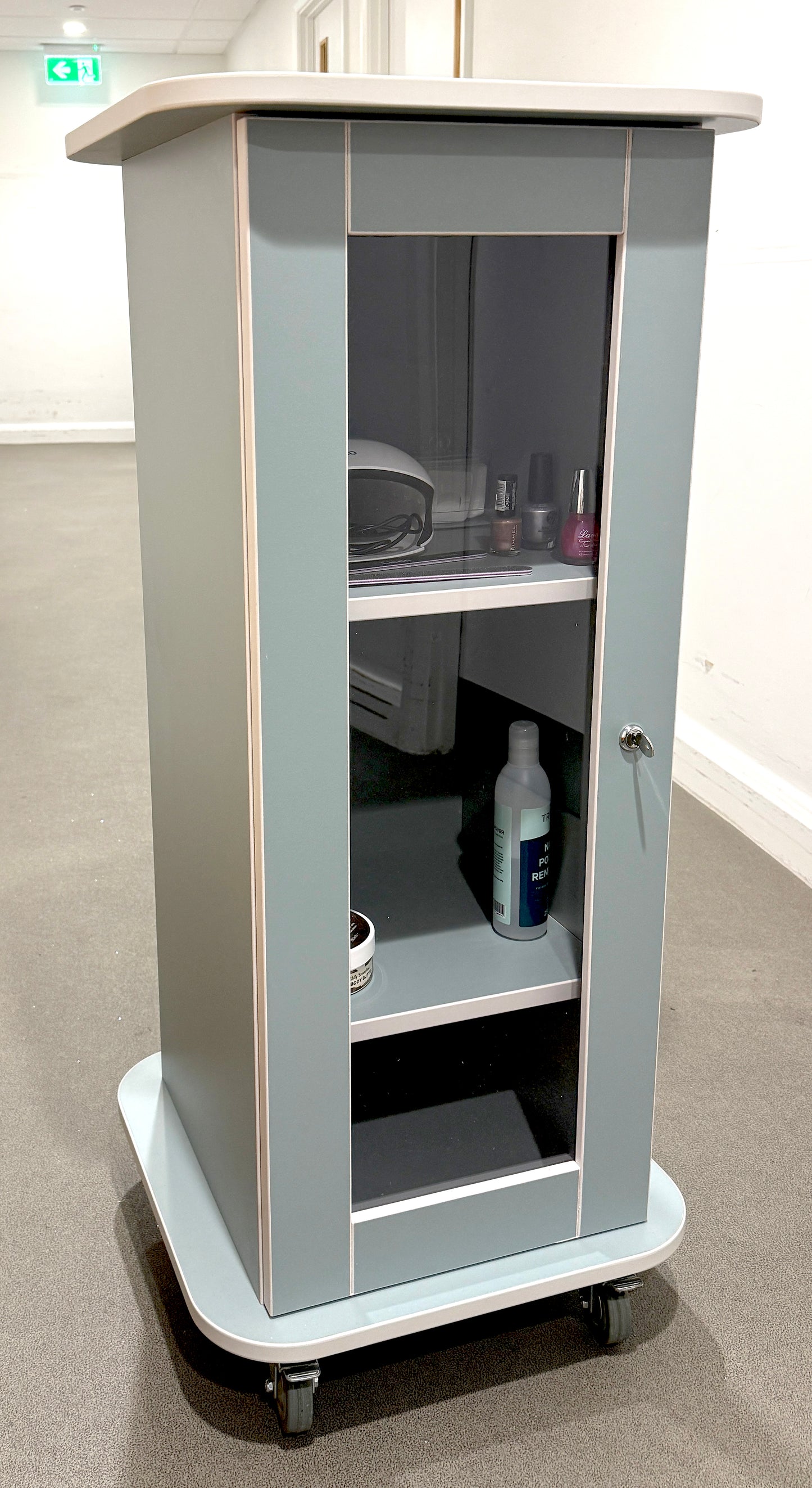 Grey and white two-tone Pamper Trolley being prepared for use