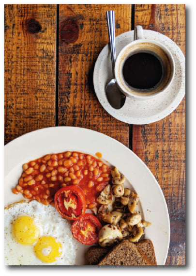 Dementia-friendly reminiscence image of a delicious plate of freshly cooked English breakfast with beans, mushrooms, tomato, toast and a cup of coffee